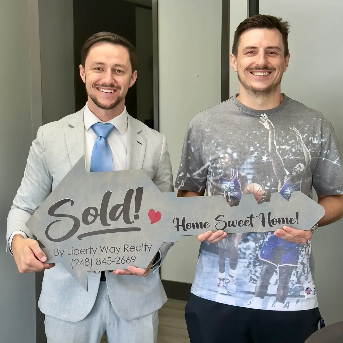 Keith Fitzpatrick III, Realtor, with buyer client Andrew after closing on his Michigan home.