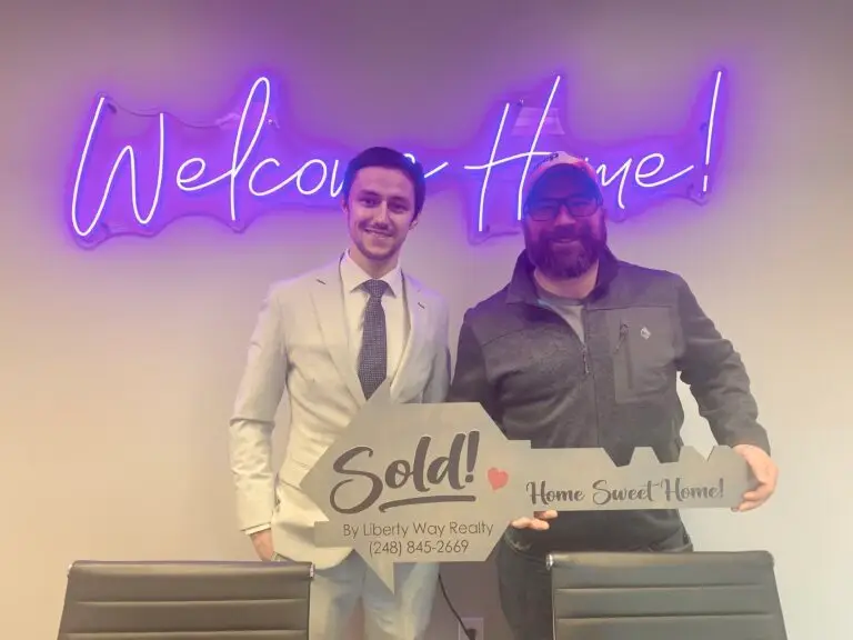 Keith Fitzpatrick III, Realtor, with client Nate after closing on an Airbnb investment property in Michigan.