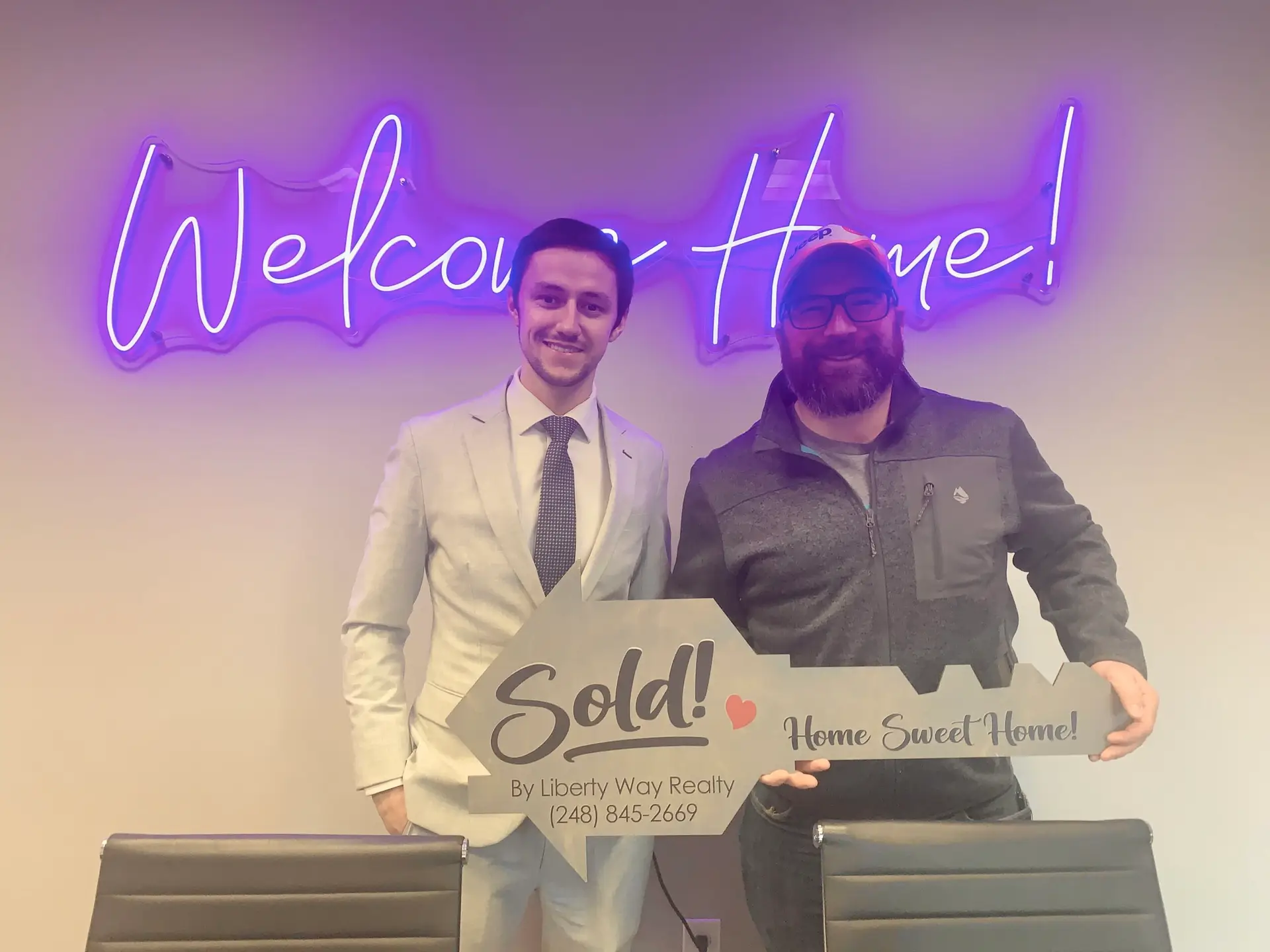 Keith Fitzpatrick III, Realtor, with client Nate after closing on an Airbnb investment property in Michigan.