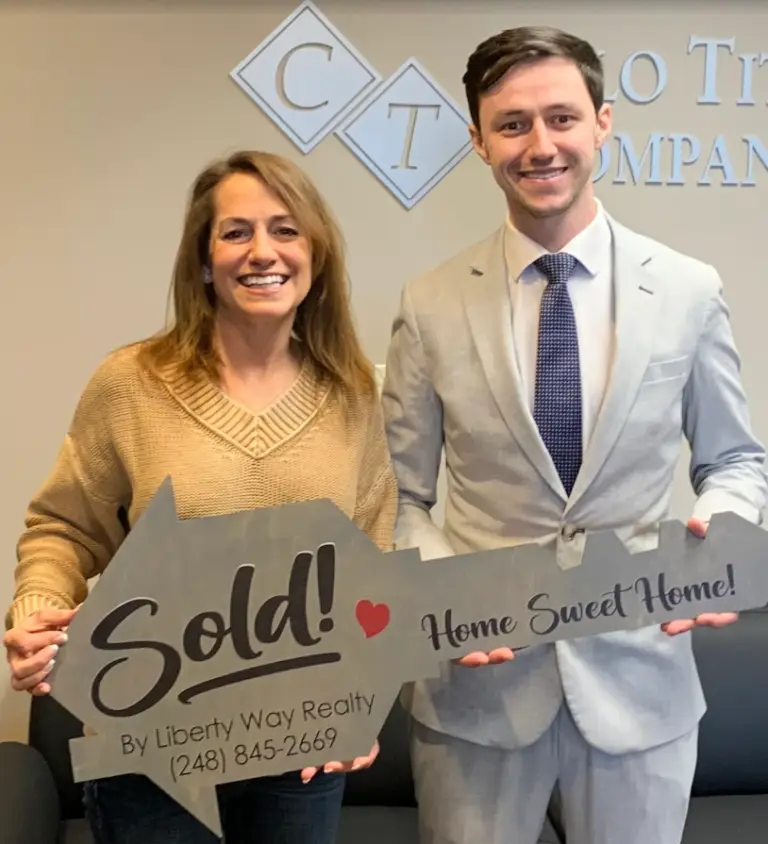 Keith Fitzpatrick III, Realtor, with client Donna after the successful sale of her Metro Detroit home.