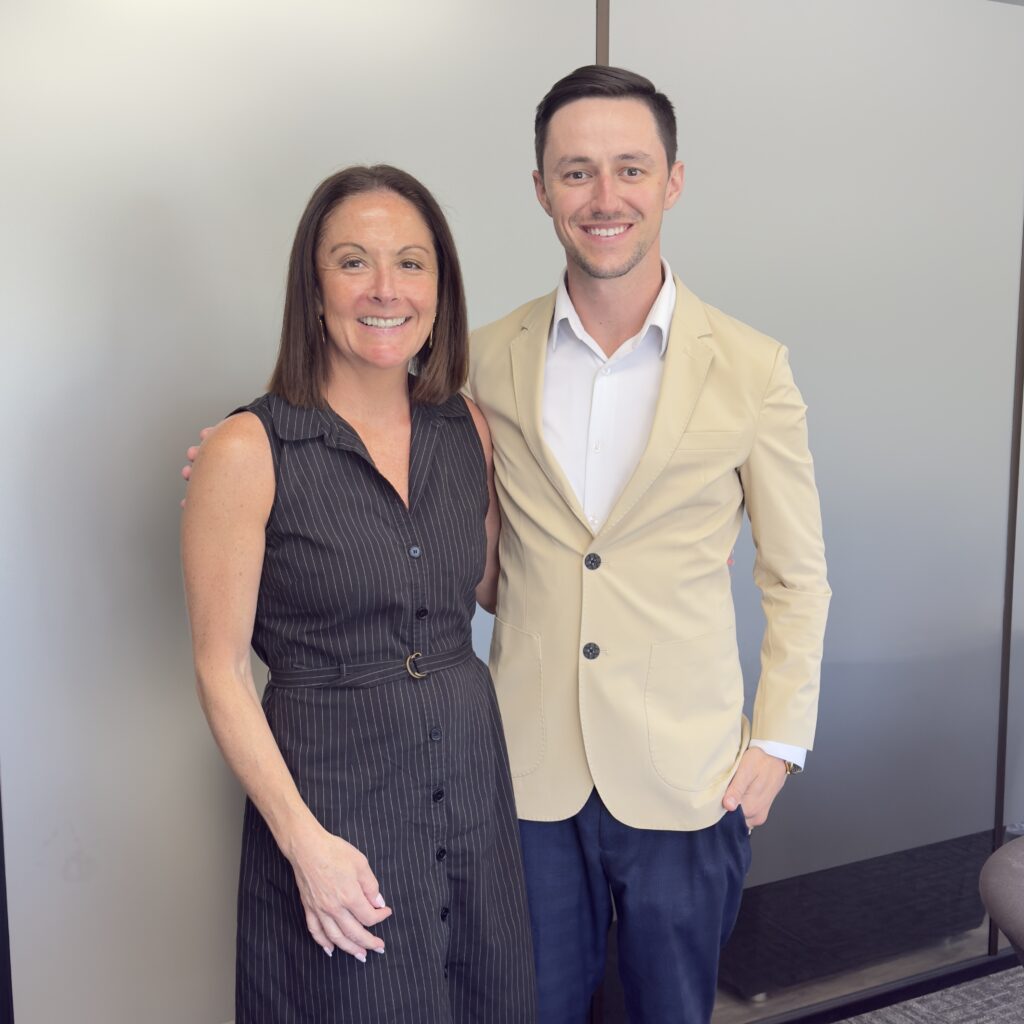 Keith Fitzpatrick III, Metro Detroit listing agent with Liberty Way Realty. Keith Fitzpatrick III, Realtor, with a seller client at the closing table after a successful Metro Detroit home sale.