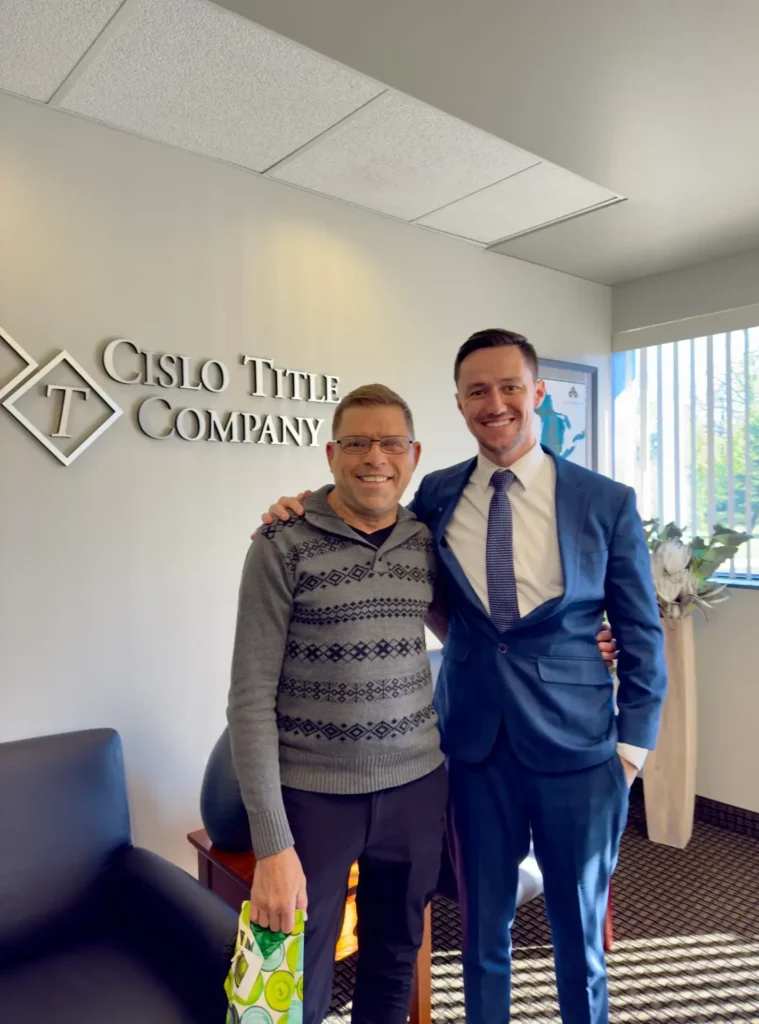 Keith Fitzpatrick III, Realtor, with a first-time homebuyer after closing on a home in Wayne, Michigan.