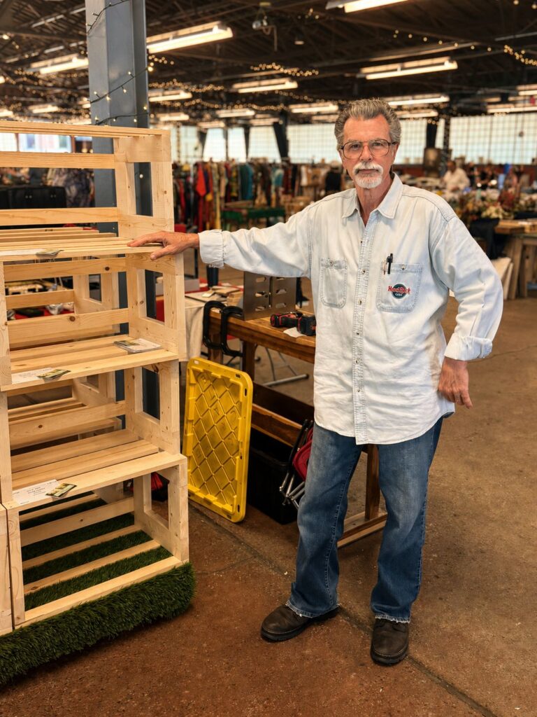 Royal Oak Antiques Market: The People Behind a Sunday Tradition 6 Leonard Christian standing beside his handmade wooden record crates at the Royal Oak Antiques Market